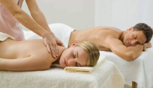 Relaxing couple massage in luxury spa for wellness and stress relief